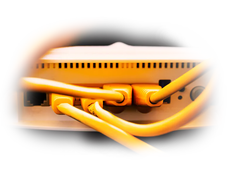 Yellow ethernet cables plugged into a network switch, representing a content management system connecting data and clean architecture.