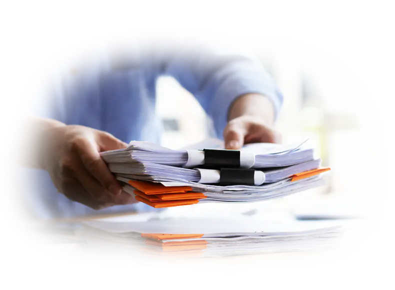 Handing over document files with binder clips, representing business criteria analysis for open source or custom web solutions.