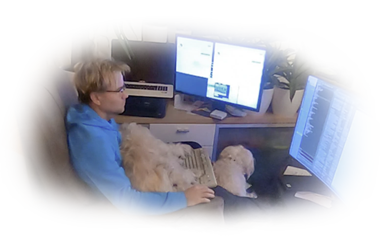 Miloslav Uhrin coding with three development monitors while a white dog rests on his lap, serving as a smart visual representation of quadrupedal QA code auditing and senior web architect programming precision since 1994.